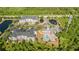Beautiful aerial view of the property with two ponds, a pool, multiple buildings, and a parking lot at 3175 Feltrim Pl # 101, Kissimmee, FL 34747
