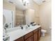 Bathroom with a shower, a single sink, and sleek cabinets, offering a modern feel at 3175 Feltrim Pl # 101, Kissimmee, FL 34747