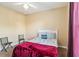Comfortable bedroom with a neutral palette, ceiling fan, and a well-lit ambiance at 3175 Feltrim Pl # 101, Kissimmee, FL 34747