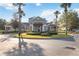 Community clubhouse with well-maintained landscaping at 3175 Feltrim Pl # 101, Kissimmee, FL 34747