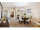 Dining area with table and chairs with view of bathroom, game table, and living room area at 3175 Feltrim Pl # 101, Kissimmee, FL 34747