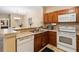 Kitchen has modern appliances, a double sink and dark wood cabinetry at 3175 Feltrim Pl # 101, Kissimmee, FL 34747