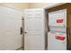 Convenient laundry room with a stacked washer and dryer unit at 3175 Feltrim Pl # 101, Kissimmee, FL 34747
