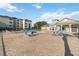 Community pool featuring lounge chairs, tables, and umbrellas at 3175 Feltrim Pl # 101, Kissimmee, FL 34747