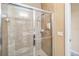 Shower stall with a glass door and tiled surround at 3175 Feltrim Pl # 101, Kissimmee, FL 34747