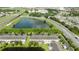 A view of the backs of the townhouses with a lake nearby at 3181 Tocoa Cir, Kissimmee, FL 34746