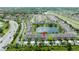 Beautiful aerial view of townhomes surrounding a tranquil pond in a well-maintained community at 3181 Tocoa Cir, Kissimmee, FL 34746