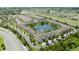 Beautiful aerial view of a townhouse community by a lake and a highway at 3181 Tocoa Cir, Kissimmee, FL 34746