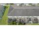 The back of the townhouses show screened in patios and well manicured grass areas at 3181 Tocoa Cir, Kissimmee, FL 34746