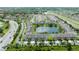 Beautiful aerial view of townhomes surrounding a tranquil pond in a well-maintained community at 3181 Tocoa Cir, Kissimmee, FL 34746