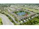 Beautiful aerial view of a townhouse community by a lake and a highway at 3181 Tocoa Cir, Kissimmee, FL 34746