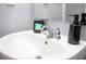 Close-up shot of bathroom sink with black soap dispenser and chrome faucet at 3181 Tocoa Cir, Kissimmee, FL 34746