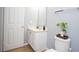 Cozy bathroom with a vanity and plant on top of the toilet seat at 3181 Tocoa Cir, Kissimmee, FL 34746