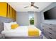 Bedroom with gray walls, a wooden slat headboard, and a flat-screen TV at 3181 Tocoa Cir, Kissimmee, FL 34746