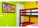 A bunk bed is placed in this bedroom decorated with lime green and yellow walls at 3181 Tocoa Cir, Kissimmee, FL 34746