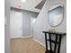 Light-filled entryway with tile floors, neutral walls, staircase, and decorative console table at 3181 Tocoa Cir, Kissimmee, FL 34746