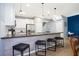 Modern kitchen featuring stainless steel appliances, granite countertops, and a breakfast bar with seating at 3181 Tocoa Cir, Kissimmee, FL 34746