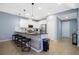 Contemporary kitchen with stainless steel appliances, seating at bar, and modern pendant lighting at 3181 Tocoa Cir, Kissimmee, FL 34746