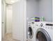 Well-equipped laundry room with stacked washer and dryer for efficient space-saving at 3181 Tocoa Cir, Kissimmee, FL 34746