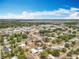Overhead shot of a residential neighborhood, highlighting rooftops, mature trees and community proximity to the lake at 320 S Seminole Ave, Lake Alfred, FL 33850