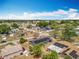A picturesque view featuring neighborhood homes, a modern design with solar panels, lush greenery, and neatly arranged streets at 320 S Seminole Ave, Lake Alfred, FL 33850