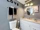 Updated bathroom with modern fixtures, vanity, and stylish decor at 320 S Seminole Ave, Lake Alfred, FL 33850