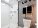 Updated bathroom featuring a glass-enclosed shower and modern fixtures at 320 S Seminole Ave, Lake Alfred, FL 33850