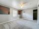 Empty bedroom features modern ceiling fan, neutral paint, and window at 320 S Seminole Ave, Lake Alfred, FL 33850