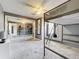 Neutral bedroom featuring a bunk bed, ceiling fan, and mirrored closet doors reflecting a second bunk bed at 320 S Seminole Ave, Lake Alfred, FL 33850
