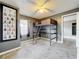 Bedroom featuring carpeted floors and a unique loft bed at 320 S Seminole Ave, Lake Alfred, FL 33850
