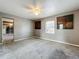 Spacious empty bedroom features neutral paint, modern ceiling fan, and window at 320 S Seminole Ave, Lake Alfred, FL 33850