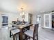 Cozy dining area features wood-look flooring and seating for four at 320 S Seminole Ave, Lake Alfred, FL 33850