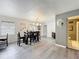 Dining room boasts wood-look floors, stylish lighting and an adjacent bathroom at 320 S Seminole Ave, Lake Alfred, FL 33850