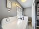 Laundry room featuring a washer, dryer, folding rack, and themed decor at 320 S Seminole Ave, Lake Alfred, FL 33850