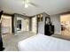 The main bedroom includes a walk-in closet and an ensuite bathroom at 320 S Seminole Ave, Lake Alfred, FL 33850