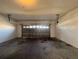 Empty garage featuring garage door and plenty of parking space at 340 Cimarron Ct, Poinciana, FL 34759