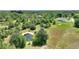 Picturesque lot with a pond, mature trees, and a charming house, nestled in a serene, green landscape at 3440 La Salle Ave, St Cloud, FL 34772