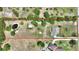 Large lot with pond featuring clear boundaries, lush trees, building, and ample space with a home at 3440 La Salle Ave, St Cloud, FL 34772