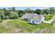 Home exterior from above, highlighting the covered patio, fenced yard, and surrounding landscape at 3440 La Salle Ave, St Cloud, FL 34772