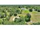 Beautiful expansive lot with a tranquil pond, lush trees, and a well-maintained house set within a serene landscape at 3440 La Salle Ave, St Cloud, FL 34772