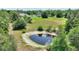 Picturesque lot featuring a serene pond, scattered trees, and a cozy home nestled in a tranquil, green landscape at 3440 La Salle Ave, St Cloud, FL 34772