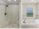 Bright bathroom features tile flooring, jacuzzi tub, and separate shower stall at 3440 La Salle Ave, St Cloud, FL 34772