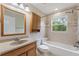 Neutral bathroom with tiled shower and tub combination plus granite vanity at 3440 La Salle Ave, St Cloud, FL 34772