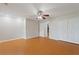This bedroom features wood floors, a ceiling fan, and closet storage at 3440 La Salle Ave, St Cloud, FL 34772