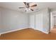 This bedroom features wood floors, a ceiling fan, and closet storage at 3440 La Salle Ave, St Cloud, FL 34772