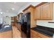 Spacious kitchen featuring wood cabinets, granite countertops, stainless steel appliances, and ample storage space at 3440 La Salle Ave, St Cloud, FL 34772