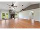 Spacious living room featuring a stone fireplace, lots of light, and views of outdoors and a connected hallway at 3440 La Salle Ave, St Cloud, FL 34772
