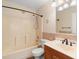 Standard bathroom featuring a tub, shower, toilet, and vanity at 454 Eagle Dr, Kissimmee, FL 34759