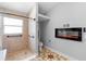 Bathroom with a tiled shower, toilet, and a stylish electric fireplace at 454 Eagle Dr, Kissimmee, FL 34759