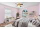 Cozy bedroom with a comfortable bed, large windows, and ample natural light at 454 Eagle Dr, Kissimmee, FL 34759